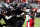 Texas Tech's Tahj Brooks (28) is stopped by North Carolina State's Drake Thomas (32), Isaiah Moore (1), Jakeen Harris (6), and Derrek Pitts Jr. (24) during the first half of an NCAA college football game in Raleigh, N.C., Saturday, Sept. 17, 2022. (AP Photo/Karl B DeBlaker)
