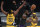 LOS ANGELES, CALIFORNIA - MARCH 12: LeBron James #23 of the Los Angeles Lakers passes between Myles Turner #33 and Justin Holiday #8 of the Indiana Pacers during the second quarter at Staples Center on March 12, 2021 in Los Angeles, California. (Photo by Harry How/Getty Images)  NOTE TO USER: User expressly acknowledges and agrees that, by downloading and/or using this Photograph, user is consenting to the terms and conditions of the Getty Images License Agreement. Mandatory Copyright Notice: Copyright 2021 NBAE.