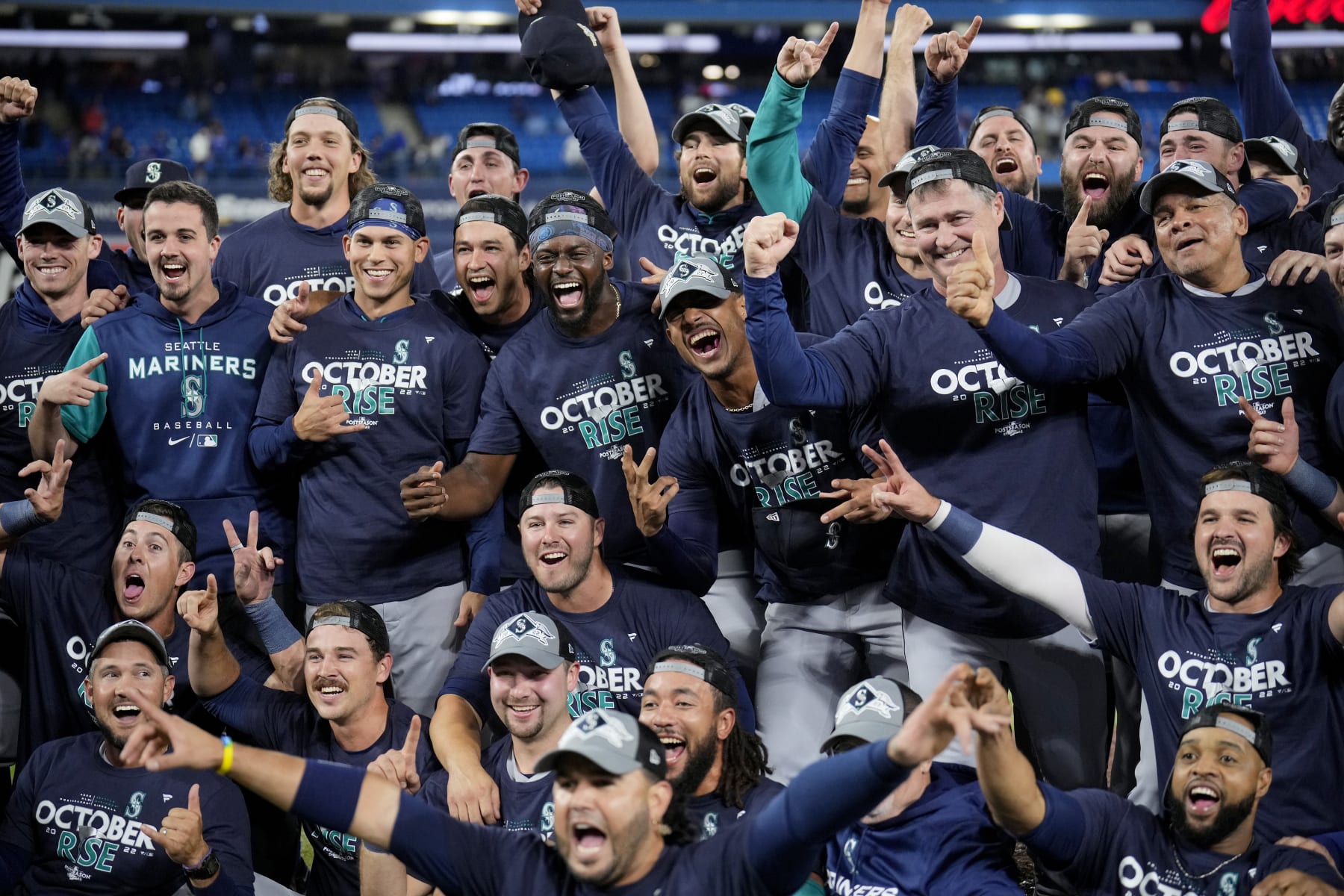 TORONTO, ONTARIO - OCTOBER 08: The Seattle Mariners celebrate after defeating the Toronto Blue Jays in game two to win the American League Wild Card Series at Rogers Centre on October 08, 2022 in Toronto, Ontario. The Seattle Mariners defeated the Toronto Blue Jays with a score of 10 to 9. (Photo by Mark Blinch/Getty Images)