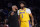 Los Angeles Lakers head coach Darvin Ham, left, talks with forward Anthony Davis during the first half of a preseason NBA basketball game against the Sacramento Kings Monday, Oct. 3, 2022, in Los Angeles. (AP Photo/Mark J. Terrill)