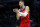 CHARLOTTE, NORTH CAROLINA - OCTOBER 10:  Kristaps Porzingis #6 of the Washington Wizards reacts following a play during the second quarter of the game against the Charlotte Hornets at Spectrum Center on October 10, 2022 in Charlotte, North Carolina. NOTE TO USER: User expressly acknowledges and agrees that, by downloading and or using this photograph, User is consenting to the terms and conditions of the Getty Images License Agreement. (Photo by Jared C. Tilton/Getty Images)