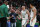 Boston - May 15: Left to right, Celtics head coach Ime Udoka, the fans, Payton Pritchard and Grant Williams celebrate one of Pritchard's three pointers. The Boston Celtics host the Milwaukee Bucks in Game 7 of the Eastern Conference semi-finals between the Celtics and Bucks on May 15, 2022 at TD Garden in Boston. (Photo by Jim Davis/The Boston Globe via Getty Images)