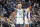 Charlotte Hornets guard Kelly Oubre Jr. (12) and Charlotte Hornets forward P.J. Washington (25) in the second half of an NBA basketball game Thursday, Dec. 23, 2021, in Denver. The Hornets won 115-107. (AP Photo/David Zalubowski)