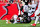 TAMPA, FLORIDA - OCTOBER 09: Grady Jarrett #97 of the Atlanta Falcons sacks Tom Brady #12 of the Tampa Bay Buccaneers during the fourth quarter of the game at Raymond James Stadium on October 09, 2022 in Tampa, Florida. (Photo by Julio Aguilar/Getty Images)