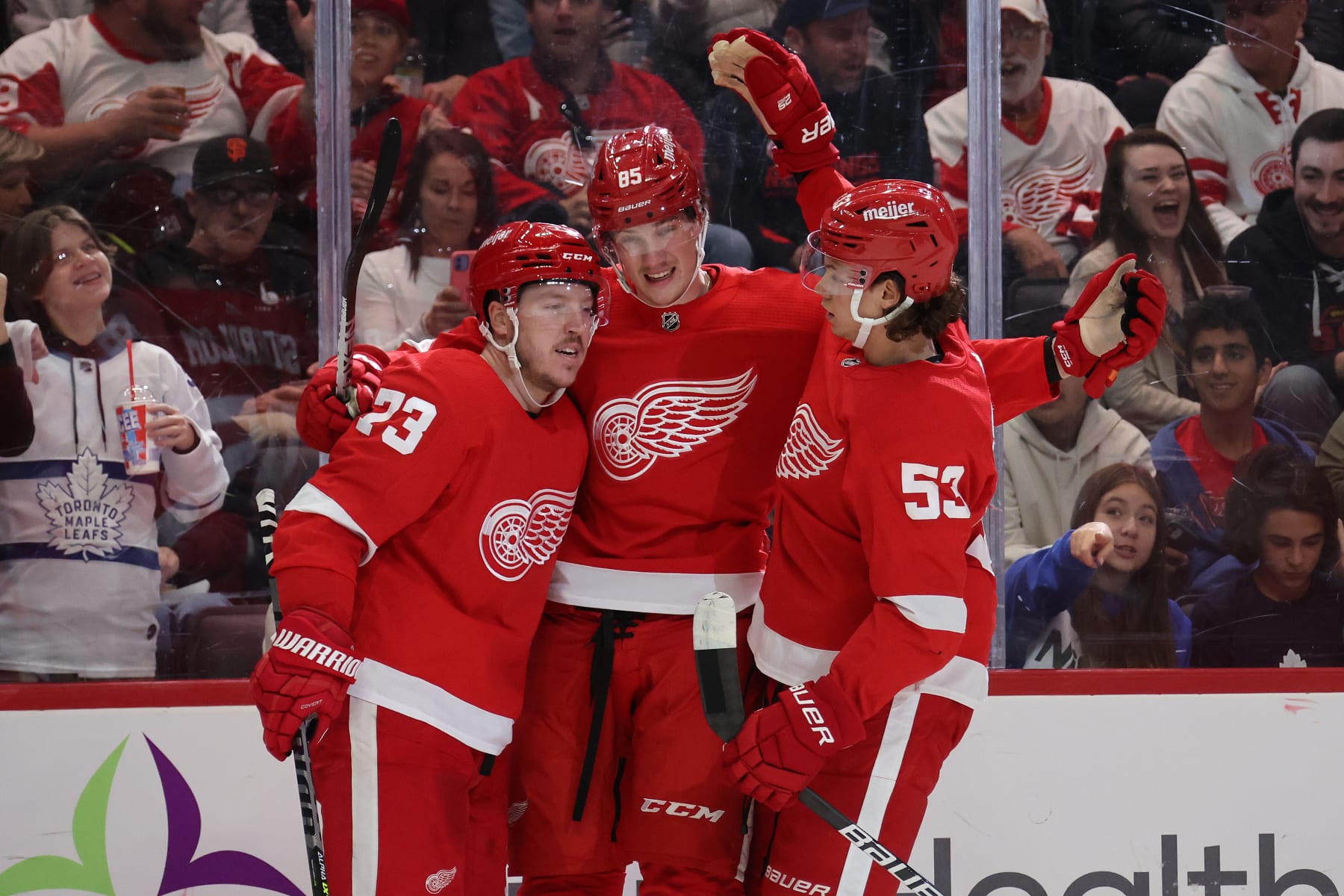 DETROIT, MICHIGAN - OCTOBER 07: Elmer Soderblom #85 of the Detroit Red Wings celebrates his second period goal with Lucas Raymond #23 and Moritz Seider #53 while playing the Toronto Maple Leafs at Little Caesars Arena on October 07, 2022 in Detroit, Michigan. Detroit won the game 4-2. (Photo by Gregory Shamus/Getty Images)