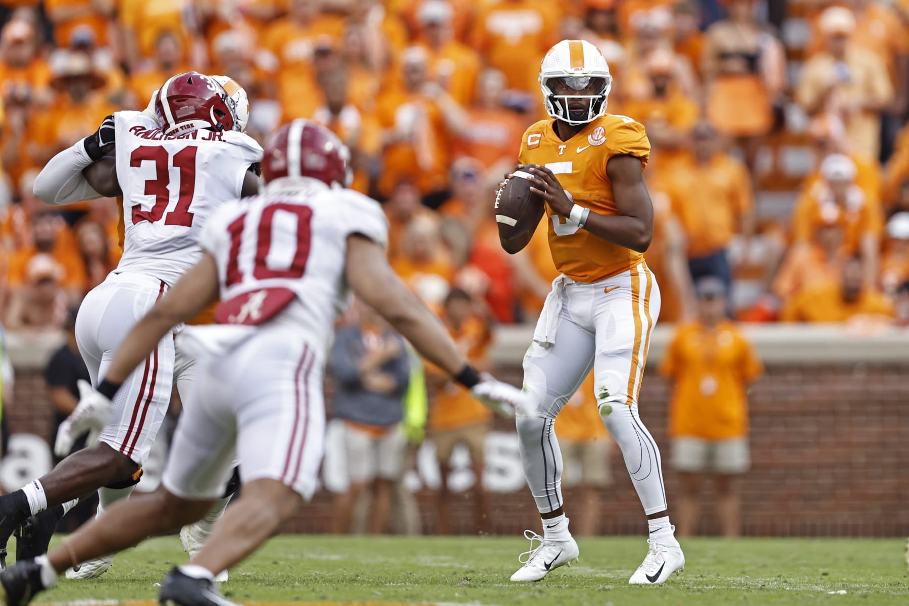Tennessee quarterback Hendon Hooker (5) looks for a receiver during the first half of an NCAA college football game against Alabama on Saturday, Oct. 15, 2022 in Knoxville, Tenn. (AP Photo/Wade Payne).