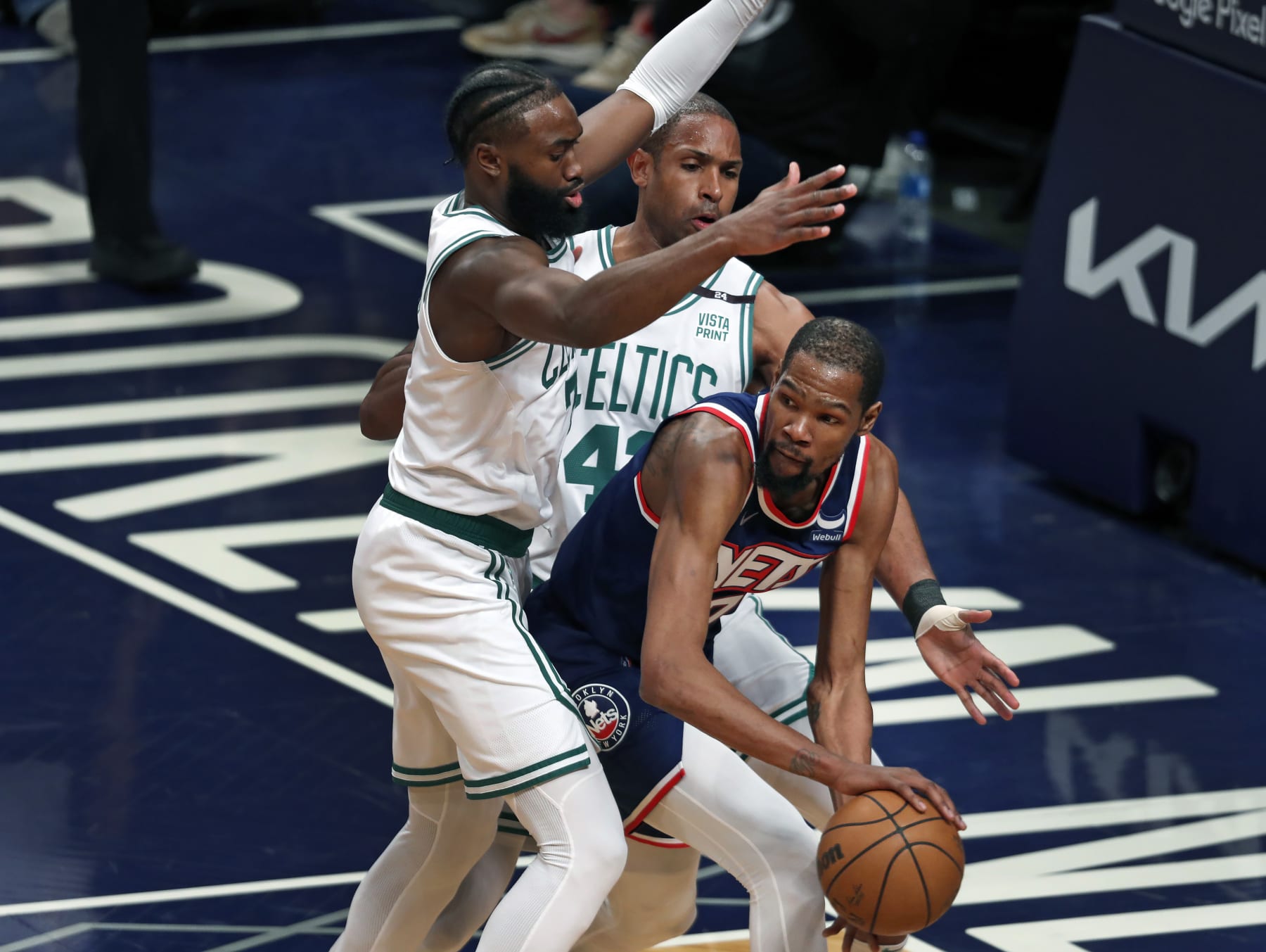 Brooklyn - April 25: The Celtics Jaylen Brown and Al Horford double team the Nets Kevin Durant in the first quarter. The Boston Celtics visited the Brooklyn Nets for Game Four of their first round NBA playoff series at Barclays Center in Brooklyn, NY on April 25, 2022. (Photo by Jim Davis/The Boston Globe via Getty Images)