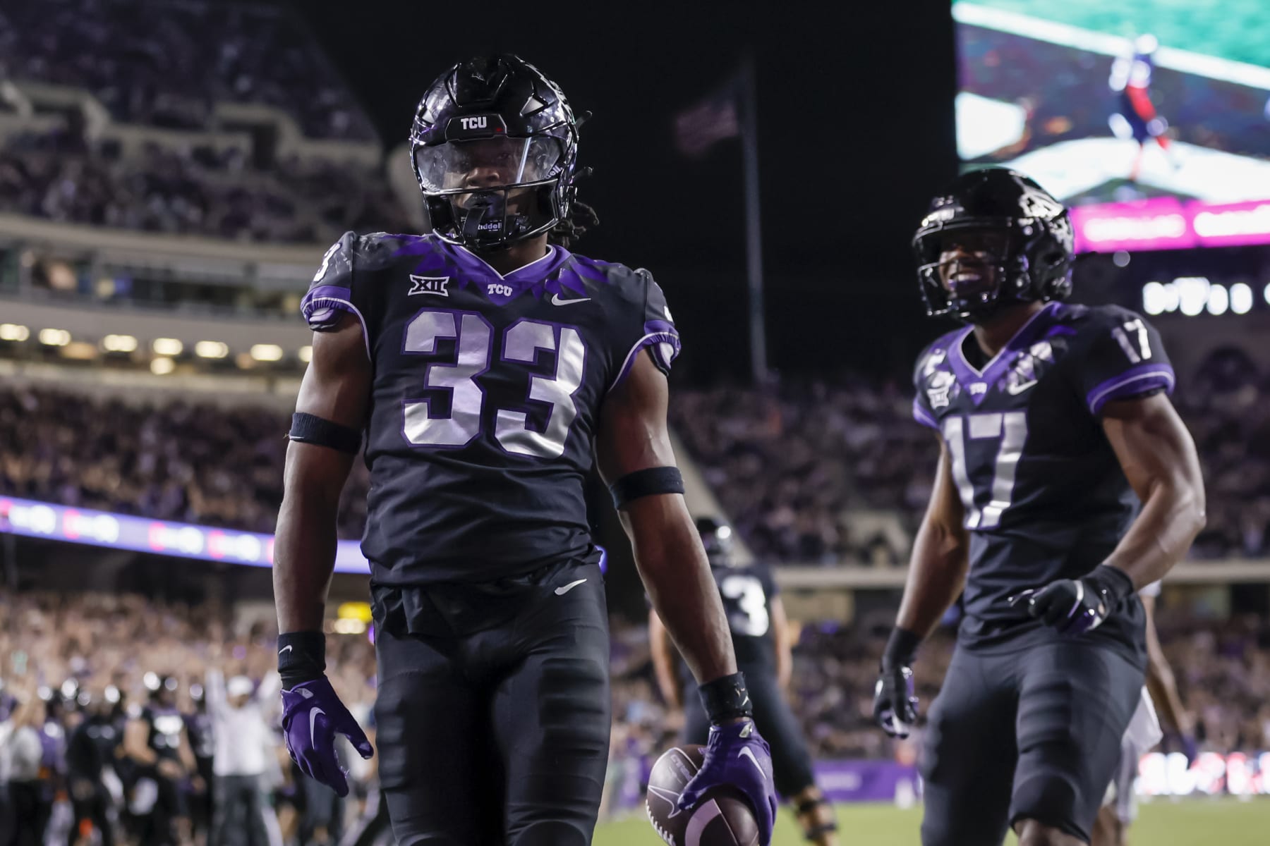 FORT WORTH, TX - OCTOBER 22: TCU Horned Frogs running back Kendre Miller (33) scores a touchdown during the game between the TCU Horned Frogs and the Kansas State Wildcats on October 22, 2022 at Amon G. Carter Stadium in Fort Worth, Texas. (Photo by Matthew Pearce/Icon Sportswire via Getty Images)