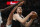 SAN ANTONIO, TX - OCTOBER 19: Jakob Poeltl #25 of the San Antonio Spurs scores past Charlotte Hornets defenders in the second half at AT&T Center on October 19,  2022 in San Antonio, Texas. NOTE TO USER: User expressly acknowledges and agrees that, by downloading and or using this photograph, User is consenting to terms and conditions of the Getty Images License Agreement. (Photo by Ronald Cortes/Getty Images)