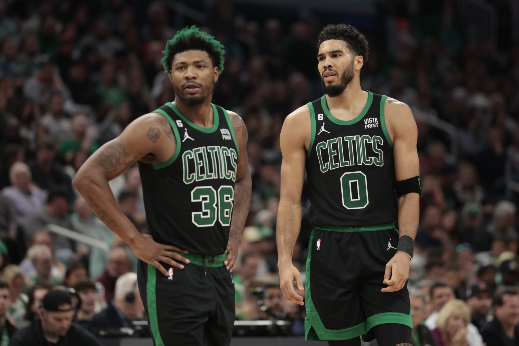 BOSTON, MASSACHUSETTS - OCTOBER 30: Jayson Tatum #0 of the Boston Celtics and Marcus Smart #36 of the Boston Celtics look on against the Washington Wizards during the second quarter at TD Garden on October 30, 2022 in Boston, Massachusetts. NOTE TO USER: User expressly acknowledges and agrees that, by downloading and or using this photograph, User is consenting to the terms and conditions of the Getty Images License Agreement. (Photo by Nick Grace/Getty Images)