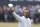 Tiger Woods of the US gestures to the crowd at the end of his second round of the British Open golf championship on the Old Course at St. Andrews, Scotland, Friday July 15, 2022. The Open Championship returns to the home of golf on July 14-17, 2022, to celebrate the 150th edition of the sport's oldest championship, which dates to 1860 and was first played at St. Andrews in 1873. (AP Photo/Peter Morrison)