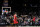 Portland Trail Blazers forward Jerami Grant (9) makes a game-wining shot over Phoenix Suns guard Devin Booker (1) during the second half of an NBA basketball game, Friday, Nov. 4, 2022, in Phoenix. The Trail Blazers defeated the Suns 108-106. (AP Photo/Matt York)