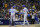 Los Angeles Dodgers' Trea Turner (6) greets teammate Mookie Betts after they both scored off a double by Freddie Freeman during the third inning in Game 4 of a baseball NL Division Series against the San Diego Padres, Saturday, Oct. 15, 2022, in San Diego. (AP Photo/Ashley Landis)