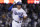 Los Angeles Dodgers' Trea Turner celebrates as he runs the bases on a solo home run against the San Diego Padres during the third inning in Game 2 of a baseball NL Division Series, Wednesday, Oct. 12, 2022, in Los Angeles. (AP Photo/Mark J. Terrill)