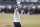 Tiger Woods of the US gestures to the crowd at the end of his second round of the British Open golf championship on the Old Course at St. Andrews, Scotland, Friday July 15, 2022. The Open Championship returns to the home of golf on July 14-17, 2022, to celebrate the 150th edition of the sport's oldest championship, which dates to 1860 and was first played at St. Andrews in 1873. (AP Photo/Peter Morrison)