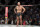 FILE - Alexander Volkanovski prepares for the last round against Brian Ortega during a featherweight mixed martial arts title bout at UFC 266, Saturday, Sept. 25, 2021, in Las Vegas. Volkanovski will defend his featherweight title in the main event at UFC 273 on Saturday night, April 9, 2022, at Veterans Memorial Arena in Jacksonville when he takes on Chan Sung Jung, better known as “The Korean Zombie." (AP Photo/John Locher, File)