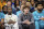 Charlotte Hornets guard Terry Rozier (3) and guard LaMelo Ball (1) watch from the bench during the first half of an NBA basketball game against Golden State Warriors on Saturday, Oct. 29, 2022, in Charlotte, N.C. (AP Photo/Scott Kinser)