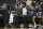FILE - Orlando Magic forward Jonathan Isaac watches from the bench between center Mo Bamba (5) and guard Cole Anthony (50) during the first half of an NBA basketball game against the Philadelphia 76ers, Sunday, March 13, 2022, in Orlando, Fla. The Orlando Magic announced Tuesday, March 15, 2022, that Jonathan Isaac, who has missed the last two years with a knee injury, will not return this season.(AP Photo/Phelan M. Ebenhack, File)