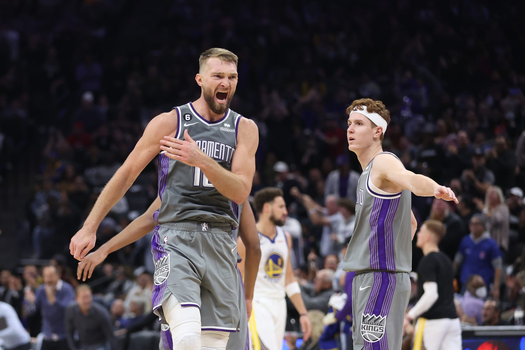 SACRAMENTO, CALIFORNIA - NOVEMBER 13: Domantas Sabonis #10 of the Sacramento Kings celebrates with Kevin Huerter #9 after a basket in the fourth quarter against the Golden State Warriors at Golden 1 Center on November 13, 2022 in Sacramento, California. NOTE TO USER: User expressly acknowledges and agrees that, by downloading and/or using this photograph, User is consenting to the terms and conditions of the Getty Images License Agreement. (Photo by Lachlan Cunningham/Getty Images)