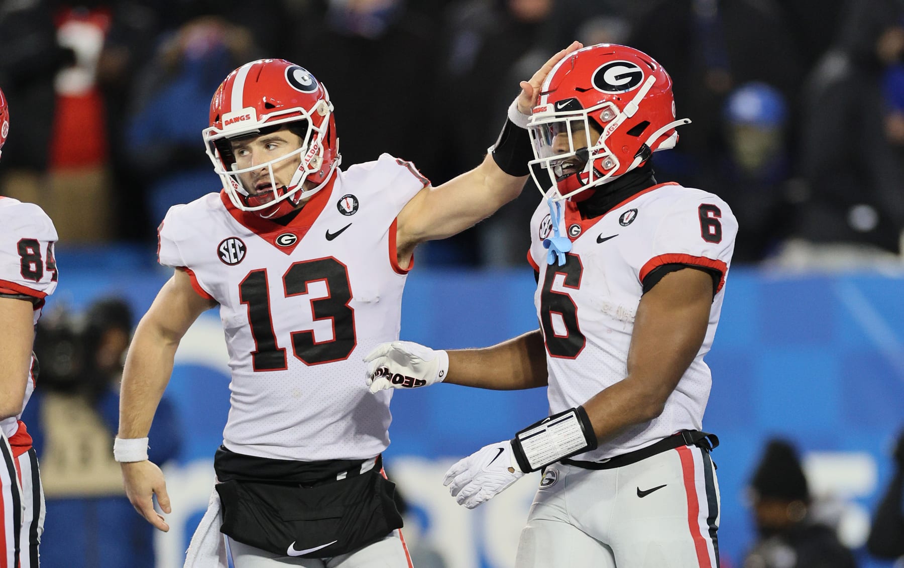 LEXINGTON, KENTUCKY - NOVEMBER 19: Stetson Bennett #13 of the Georgia Bulldogs celebrates with Kenny McIntosh #6 after a touchdown in the 16-6 win ove the Kentucky Wildcats at Kroger Field on November 19, 2022 in Lexington, Kentucky. (Photo by Andy Lyons/Getty Images)
