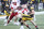 IOWA CITY, IOWA- NOVEMBER 25:  Wide receiver Nico Ragaini #89 of the Iowa Hawkeyes breaks a tackle during the first half safety Isaac Gifford #23 of the Nebraska Cornhuskers at Kinnick Stadium, on November 25, 2022 in Iowa City, Iowa.  (Photo by Matthew Holst/Getty Images)
