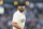San Francisco Giants' Carlos Rodón between pitches against the Milwaukee Brewers during the fourth inning of a baseball game in San Francisco, Thursday, July 14, 2022. (AP Photo/Godofredo A. Vásquez)