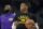 Los Angeles Lakers guard Russell Westbrook (0) and Los Angeles Lakers forward LeBron James (6) in the first half of an NBA basketball game Saturday Jan. 15, 202, in Denver. (AP Photo/David Zalubowski)
