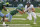 UCF quarterback John Rhys Plumlee tries to get past Tulane linebacker Devean Deal.