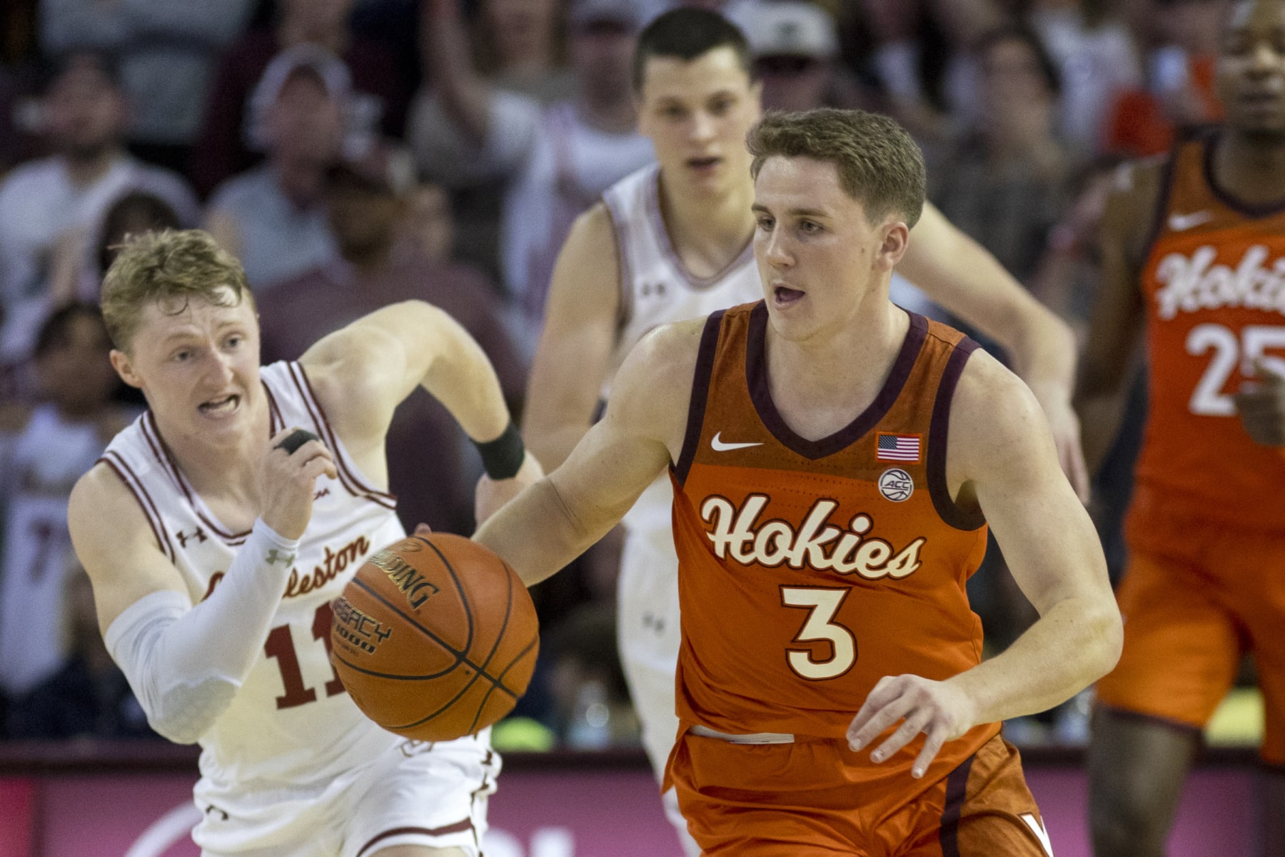 Virginia Tech's Sean Pedulla (3) drives the basketball against the defense of College of Charleston's Ryan Larson (11) in the second half of an NCAA college basketball game during the championship of the Charleston Classic in Charleston, S.C., Sunday, Nov. 20, 2022. (AP Photo/Mic Smith)