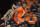 Illinois' Dain Dainja (42) works the ball inside against Monmouth's Tahron Allen during the second half of an NCAA college basketball game, Monday, Nov. 14, 2022, in Champaign, Ill. (AP Photo/Michael Allio)