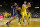 ANN ARBOR, MICHIGAN - NOVEMBER 29: Hunter Dickinson #1 of the Michigan Wolverines posts up against Kadin Shedrick #21 of the Virginia Cavaliers in the second half at Crisler Arena on November 29, 2022 in Ann Arbor, Michigan. (Photo by Mike Mulholland/Getty Images)