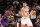 PHOENIX, ARIZONA - NOVEMBER 30: Nikola Vucevic #9 of the Chicago Bulls handles the ball against Deandre Ayton #22 of the Phoenix Suns during the first half of the NBA game at Footprint Center on November 30, 2022 in Phoenix, Arizona. The Suns defeated the Bulls 132-113. NOTE TO USER: User expressly acknowledges and agrees that, by downloading and or using this photograph, User is consenting to the terms and conditions of the Getty Images License Agreement. (Photo by Christian Petersen/Getty Images)