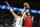 Chicago Bulls guard Zach LaVine (8) shoots over Dallas Mavericks guard Luka Doncic (77) in the first half of an NBA basketball game in Dallas, Sunday, Jan. 9, 2022. (AP Photo/Tim Heitman)