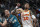 Detroit Pistons forward Bojan Bogdanovic (44) and Atlanta Hawks forward John Collins (20) battle for position in the second half of an NBA basketball game in Detroit, Friday, Oct. 28, 2022. (AP Photo/Paul Sancya)