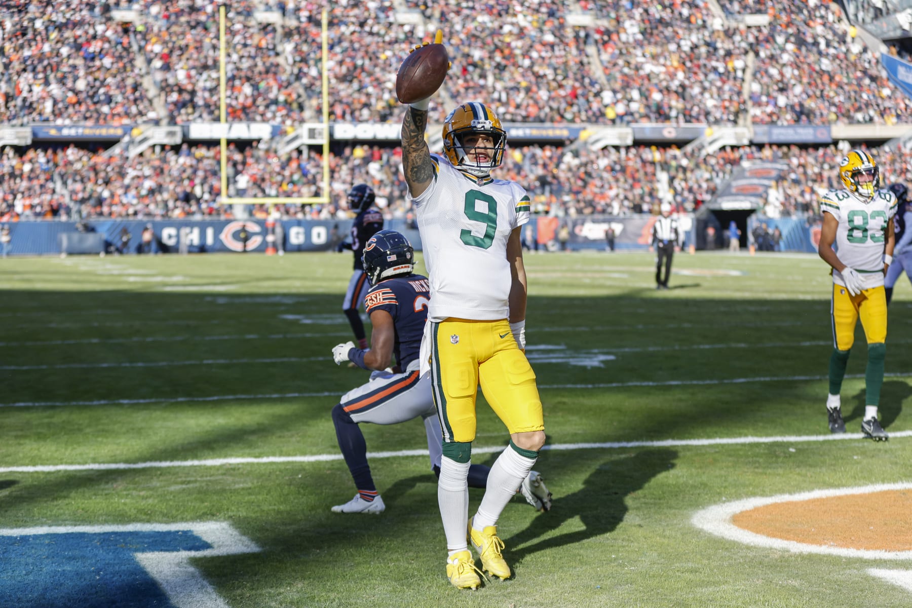 Green Bay Packers wide receiver Christian Watson (9) celebrates after scoring a touchdown against the Chicago Bears during the first half of an NFL football game, Sunday, Dec. 4, 2022, in Chicago. (AP Photo/Kamil Krzaczynski)
