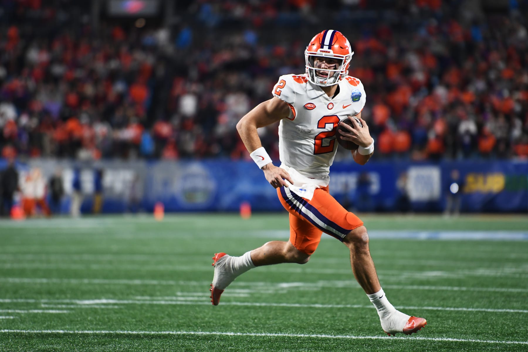 CHARLOTTE, NORTH CAROLINA - DECEMBER 03: Cade Klubnik #2 of the Clemson Tigers runs for a second quarter touchdown against the North Carolina Tar Heels during the ACC Championship game at Bank of America Stadium on December 03, 2022 in Charlotte, North Carolina. (Photo by Eakin Howard/Getty Images)