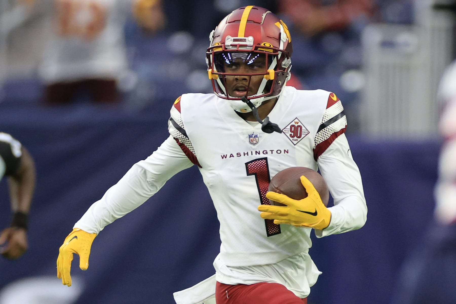 HOUSTON, TEXAS - NOVEMBER 20: Jahan Dotson #1 of the Washington Commanders runs with the ball in the first quarter of a game against the Houston Texans at NRG Stadium on November 20, 2022 in Houston, Texas. (Photo by Carmen Mandato/Getty Images)