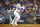 LOS ANGELES, CALIFORNIA - OCTOBER 11: Cody Bellinger #35 of the Los Angeles Dodgers hits and reaches first base on a fielding error by the San Diego Padres during the third inning in game one of the National League Division Series at Dodger Stadium on October 11, 2022 in Los Angeles, California. (Photo by Ronald Martinez/Getty Images)