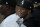 Chicago White Sox's Tim Anderson smiles as he sits in the dugout during the first inning of a baseball game against the Detroit Tigers Saturday, Sept. 24, 2022, in Chicago. (AP Photo/Charles Rex Arbogast)