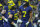 INDIANAPOLIS, IN - DECEMBER 04: Members of the Michigan Wolverines celebrate with Donovan Edwards #7 of the Michigan Wolverines after a touchdown during the second half of the Big Ten Championship against the Purdue Boilermakers at Lucas Oil Stadium on December 3, 2022 in Indianapolis, Indiana. (Photo by Michael Hickey/Getty Images)