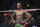 Israel Adesanya prepares to fight Jared Cannonier in a middleweight title bout during the UFC 276 mixed martial arts event Saturday, July 2, 2022, in Las Vegas. (AP Photo/John Locher)