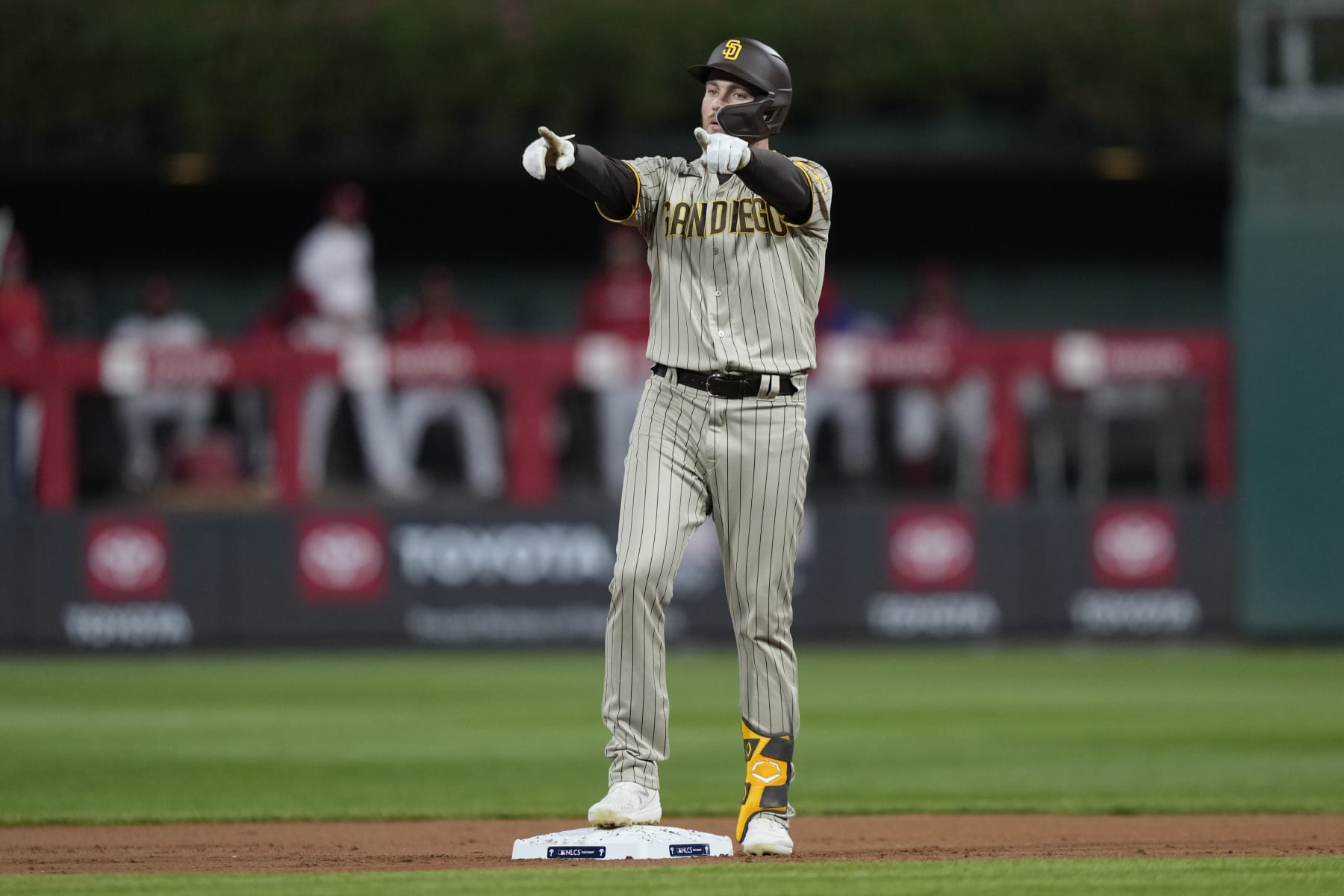 San Diego Padres' Brandon Drury celebrates after a two-run double during the first inning in Game 4 of the baseball NL Championship Series between the San Diego Padres and the Philadelphia Phillies on Saturday, Oct. 22, 2022, in Philadelphia. (AP Photo/Matt Slocum)