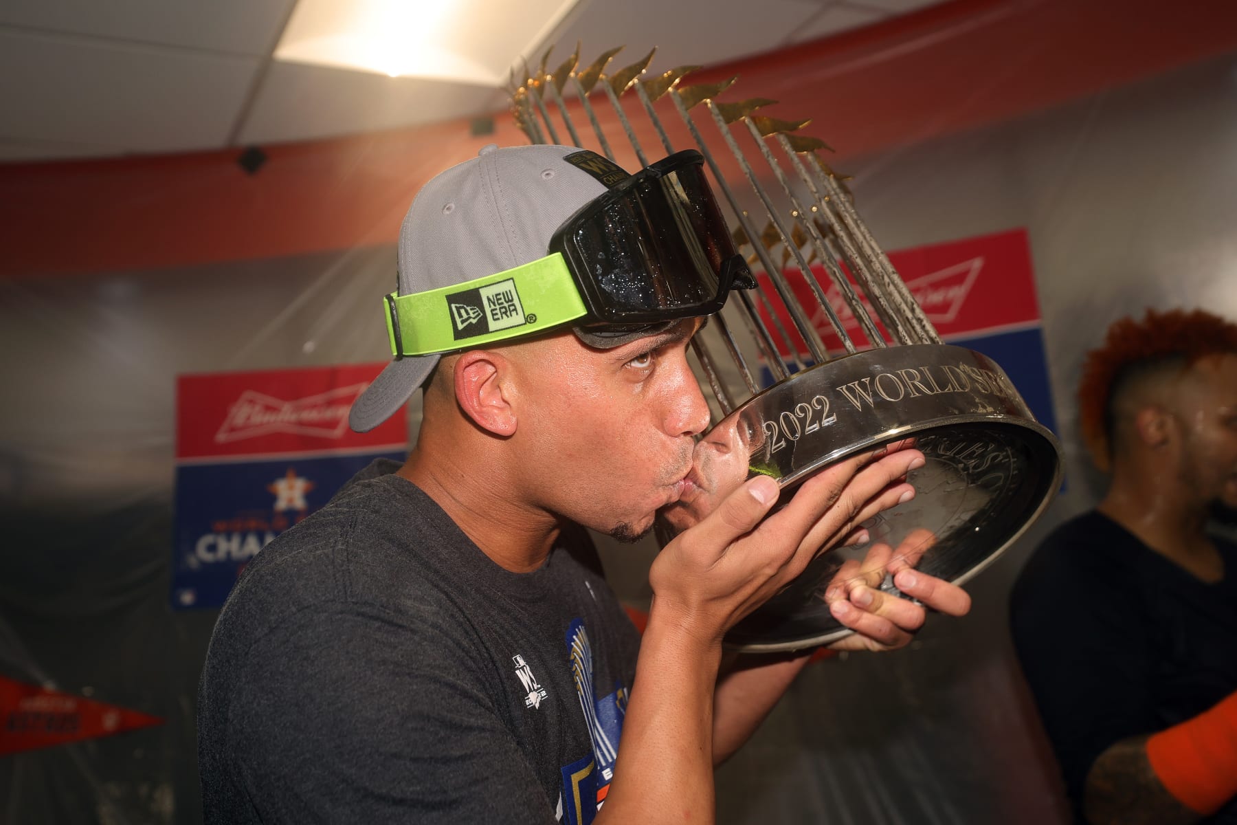 HOUSTON, TEXAS - NOVEMBER 05: Michael Brantley #23 of the Houston Astros celebrates in the clubhouse while holding the commissioner's trophy after defeating the Philadelphia Phillies 4-1 to win the 2022 World Series in Game Six of the 2022 World Series at Minute Maid Park on November 05, 2022 in Houston, Texas. (Photo by Carmen Mandato/Getty Images)