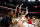 COLUMBUS, OH - DECEMBER 08:  Tanner Holden #0 of the Ohio State Buckeyes is congratulated by his teammates after scoring the game winning basket at the buzzer to defeat the Rutgers Scarlet Knights at the Jerome Schottenstein Center on December 8, 2022 in Columbus, Ohio. Ohio State defeated Rutgers 67-66. (Photo by Kirk Irwin/Getty Images)