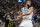 Utah Jazz guard Jordan Clarkson (00) steals the ball from Minnesota Timberwolves center Rudy Gobert, right, during the second half of an NBA basketball game Friday, Dec. 9, 2022, in Salt Lake City. (AP Photo/Rick Bowmer)