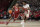 Alabama forward Brandon Miller (24) drives on Houston guard Terrance Arceneaux (23) during the first half of an NCAA college basketball game, Saturday, Dec. 10, 2022, in Houston. (AP Photo/Kevin M. Cox)