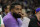 NFL player Odell Beckham Jr. watches action during the first half of an NBA basketball game between the Phoenix Suns and the Boston Celtics, Wednesday, Dec. 7, 2022, in Phoenix. (AP Photo/Rick Scuteri)