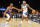 Phoenix Suns' Mikal Bridges (25) guards Washington Wizards' Bradley Beal (3) during the first half of an NBA basketball game in Phoenix, Tuesday, Dec. 20, 2022. (AP Photo/Darryl Webb)