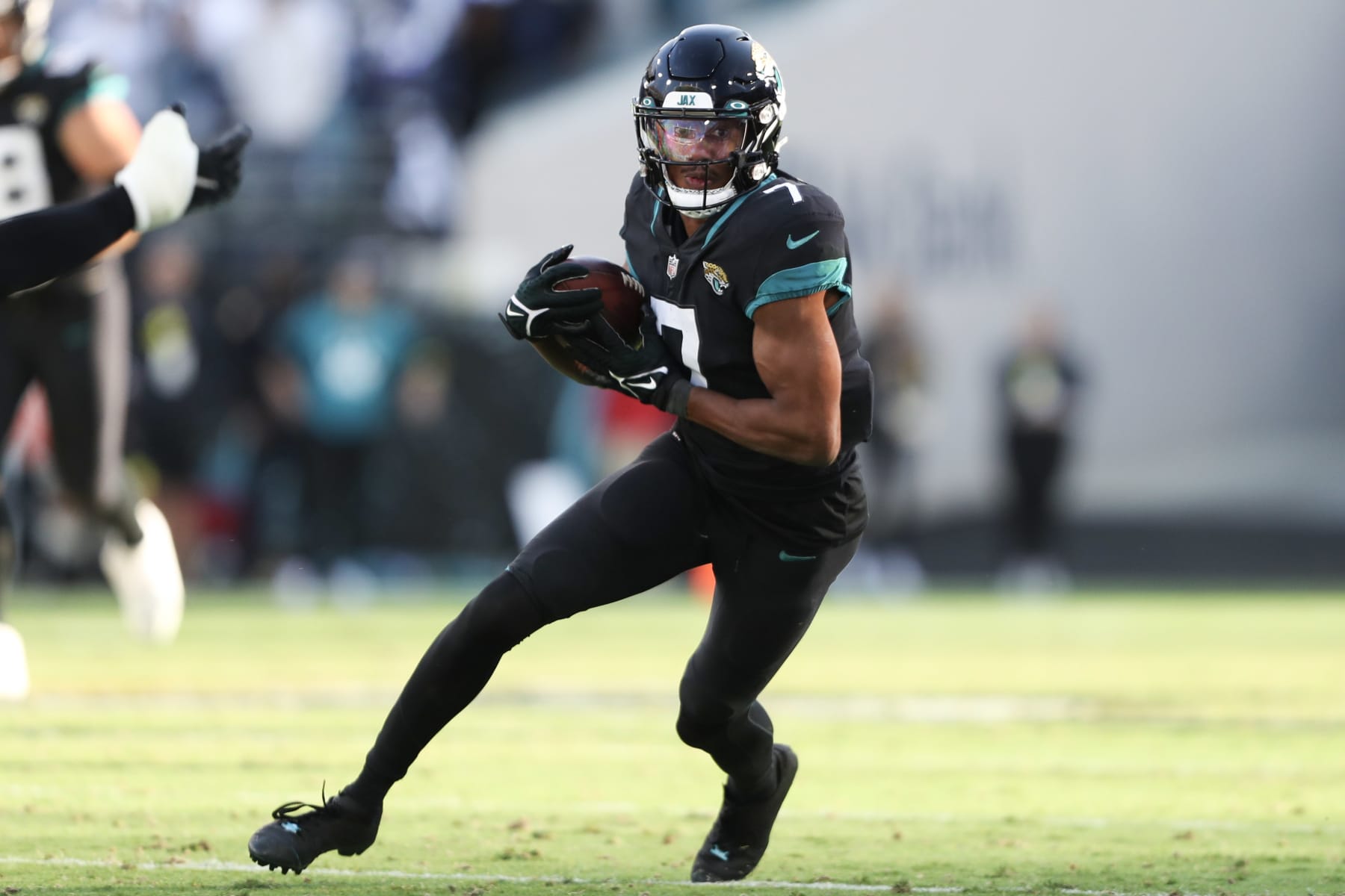 JACKSONVILLE, FLORIDA - DECEMBER 18: Zay Jones #7 of the Jacksonville Jaguars carries the ball during the second half against the Dallas Cowboys at TIAA Bank Field on December 18, 2022 in Jacksonville, Florida. (Photo by Courtney Culbreath/Getty Images)