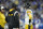 Pittsburgh Steelers head coach Mike Tomlin talks with quarterback Kenny Pickett during the second half of an NFL football game against the Indianapolis Colts, Monday, Nov. 28, 2022, in Indianapolis. (AP Photo/Michael Conroy)